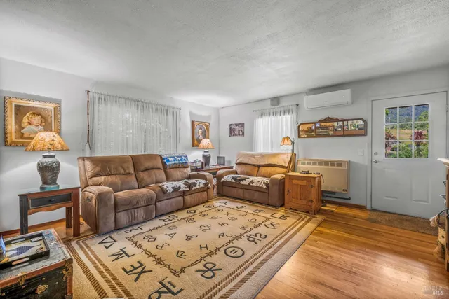 a living room with furniture and a table