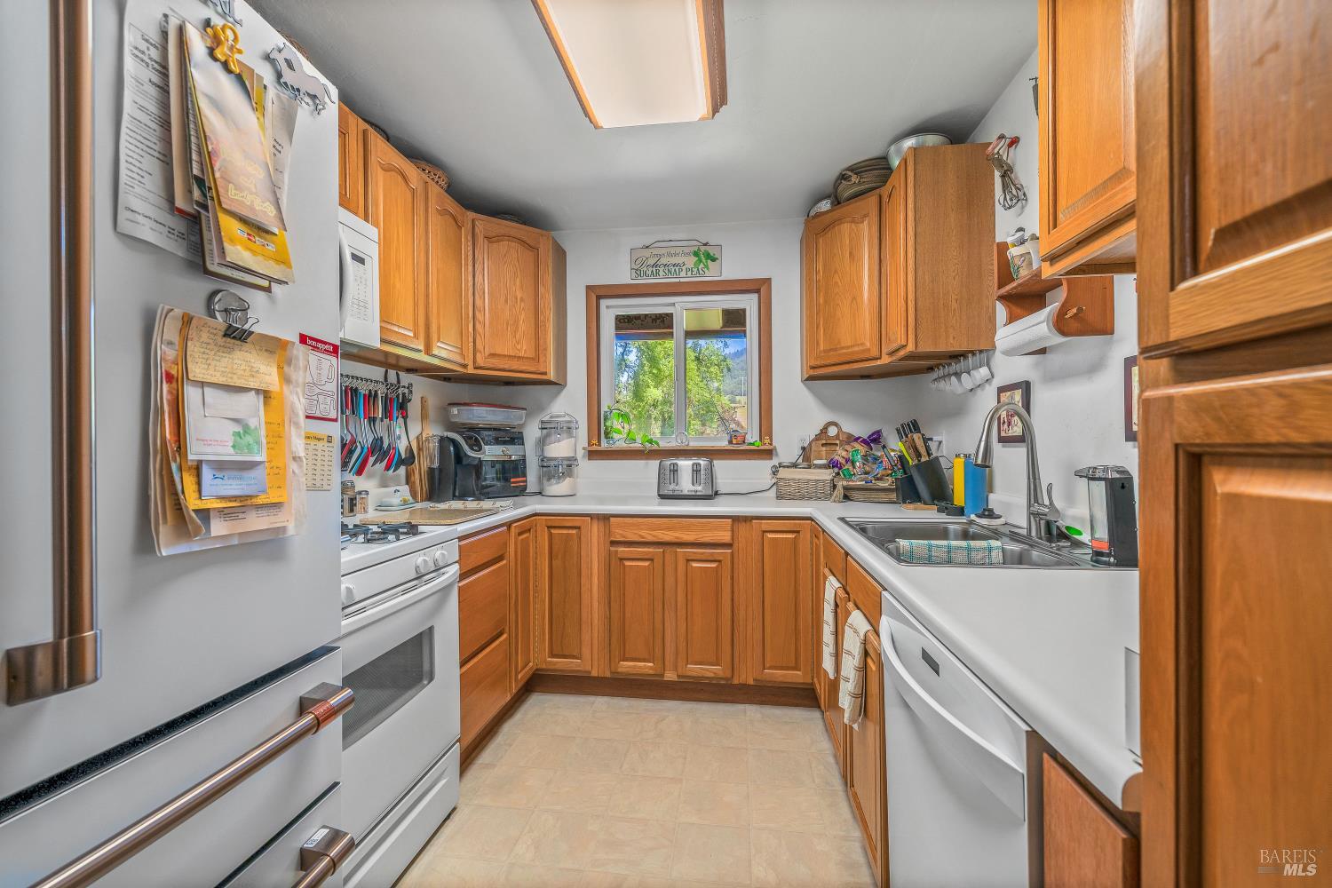 3901 Canyon Road Willits, CA 95490 - Photo 5 of 35 a kitchen with stainless steel appliances granite countertop lots of counter top space and windows