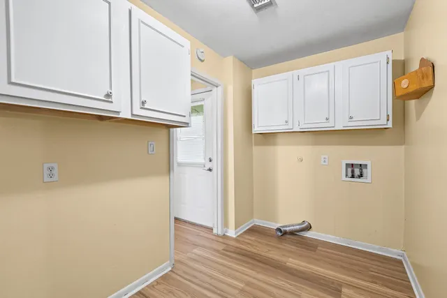 a front view of a house with a yard table and chairs