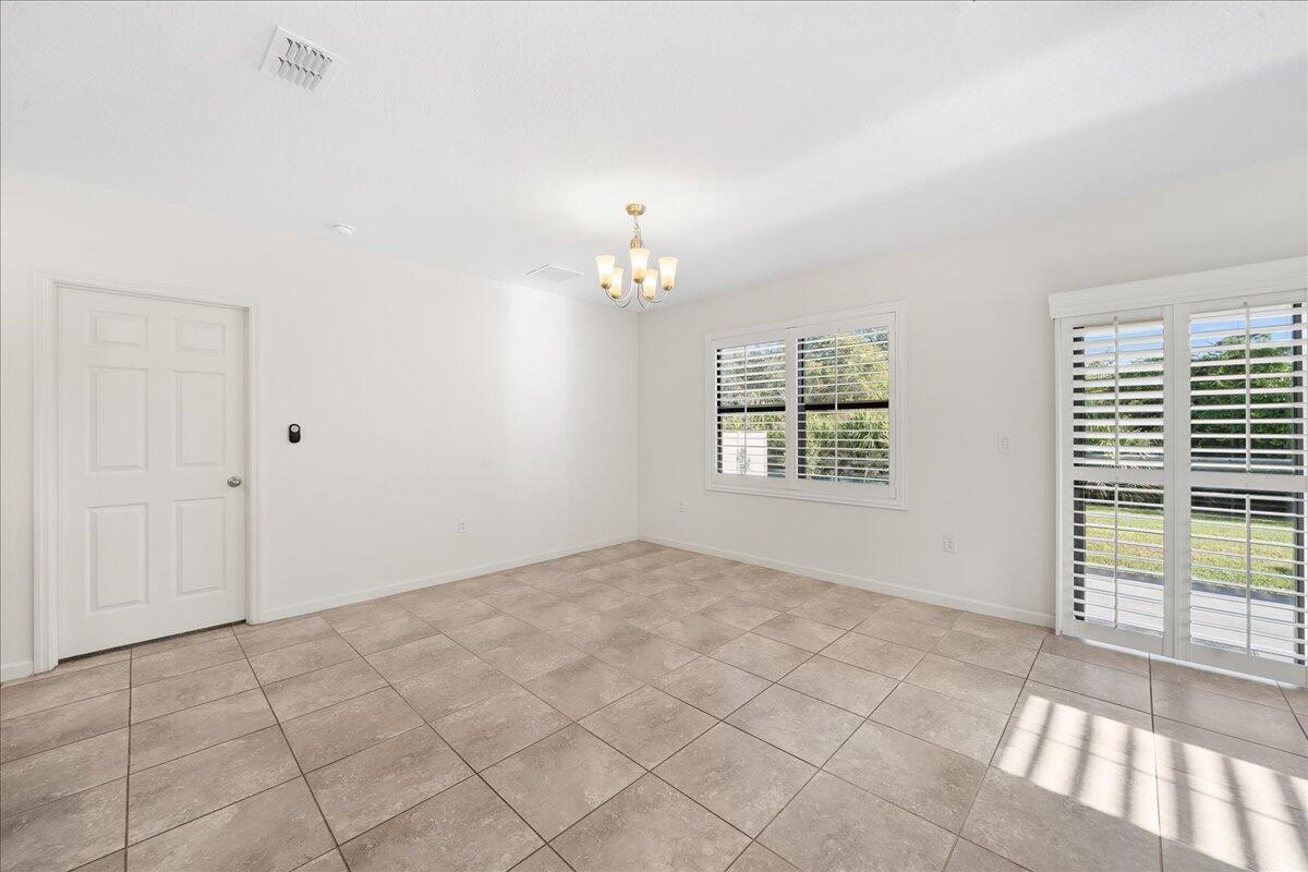 710 Old Country Rd S East Palm Bay, FL 32909 - Photo 11 of 27 a view of an empty room with a window