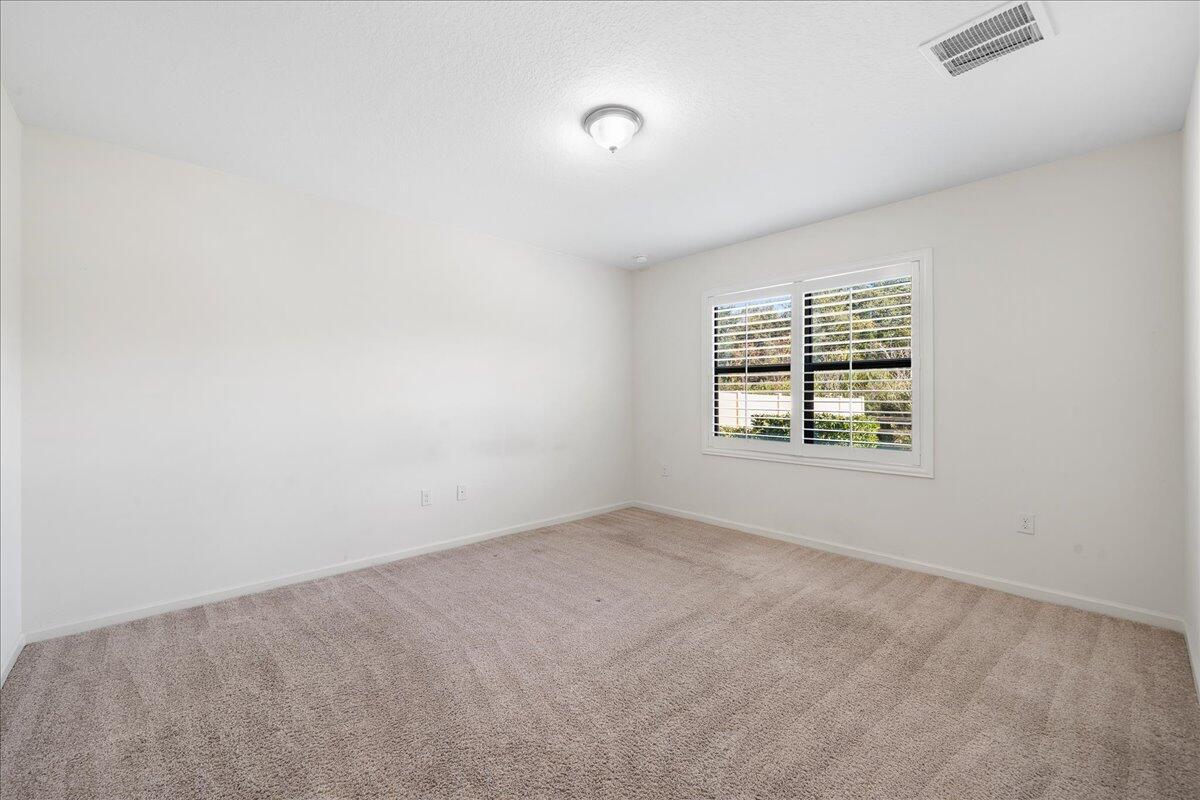 710 Old Country Rd S East Palm Bay, FL 32909 - Photo 12 of 27 an empty room with windows