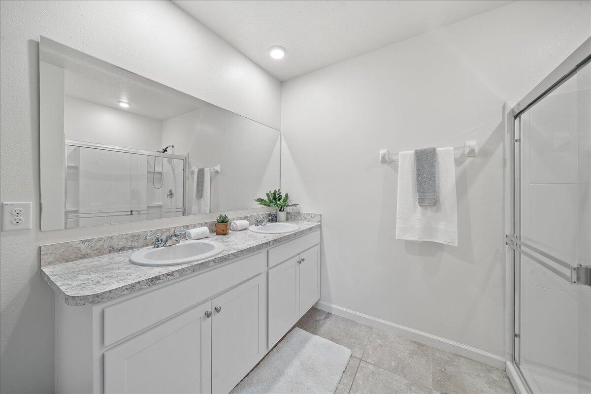 710 Old Country Rd S East Palm Bay, FL 32909 - Photo 14 of 27 a bathroom with a granite countertop sink and a mirror