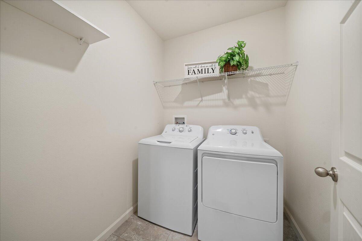 710 Old Country Rd S East Palm Bay, FL 32909 - Photo 20 of 27 a utility room with dryer and washer