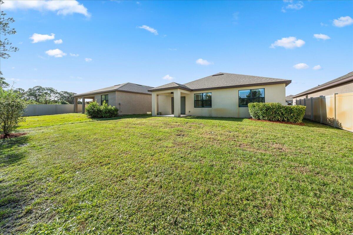 710 Old Country Rd S East Palm Bay, FL 32909 - Photo 23 of 27 a view of a house with a yard
