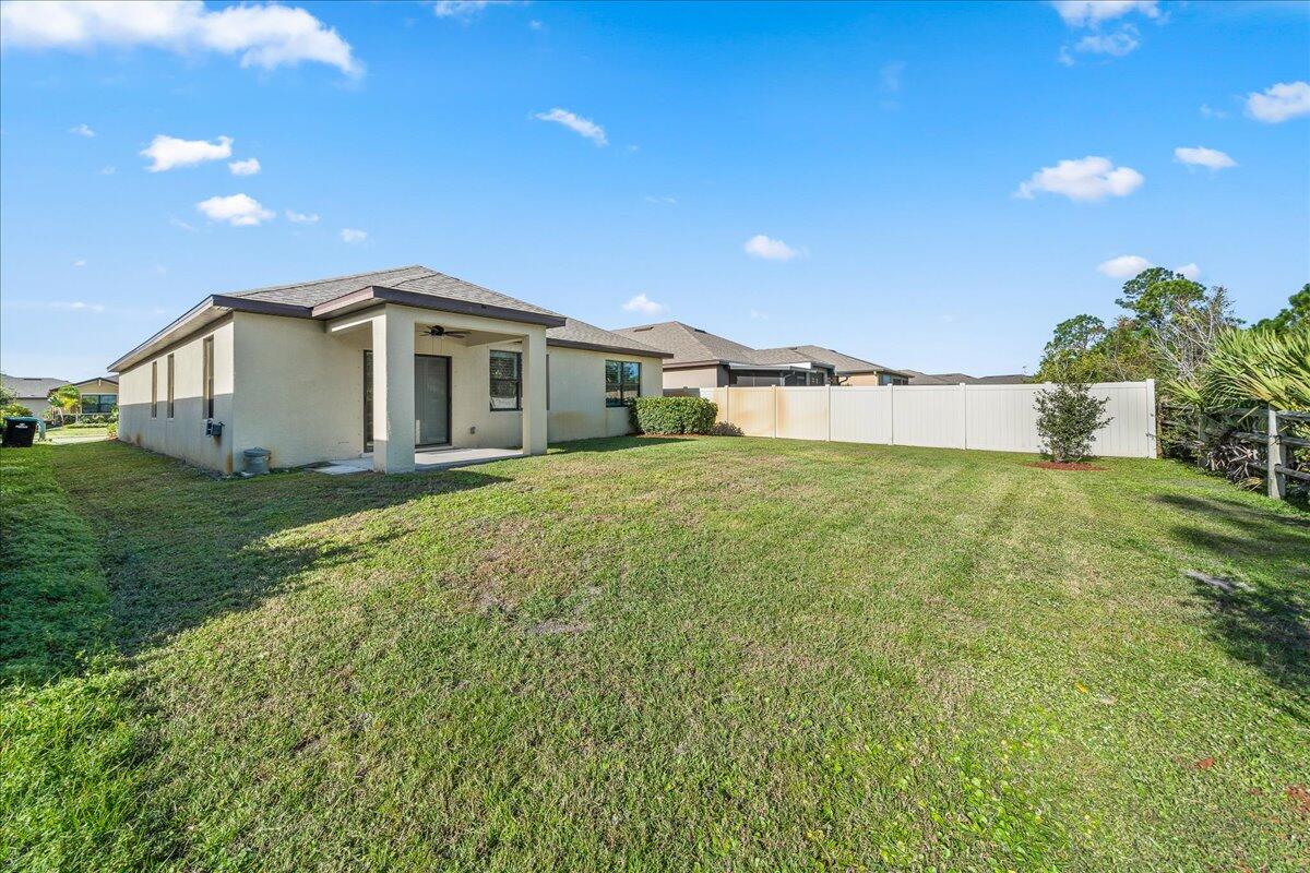 710 Old Country Rd S East Palm Bay, FL 32909 - Photo 26 of 27 a view of a house with a yard