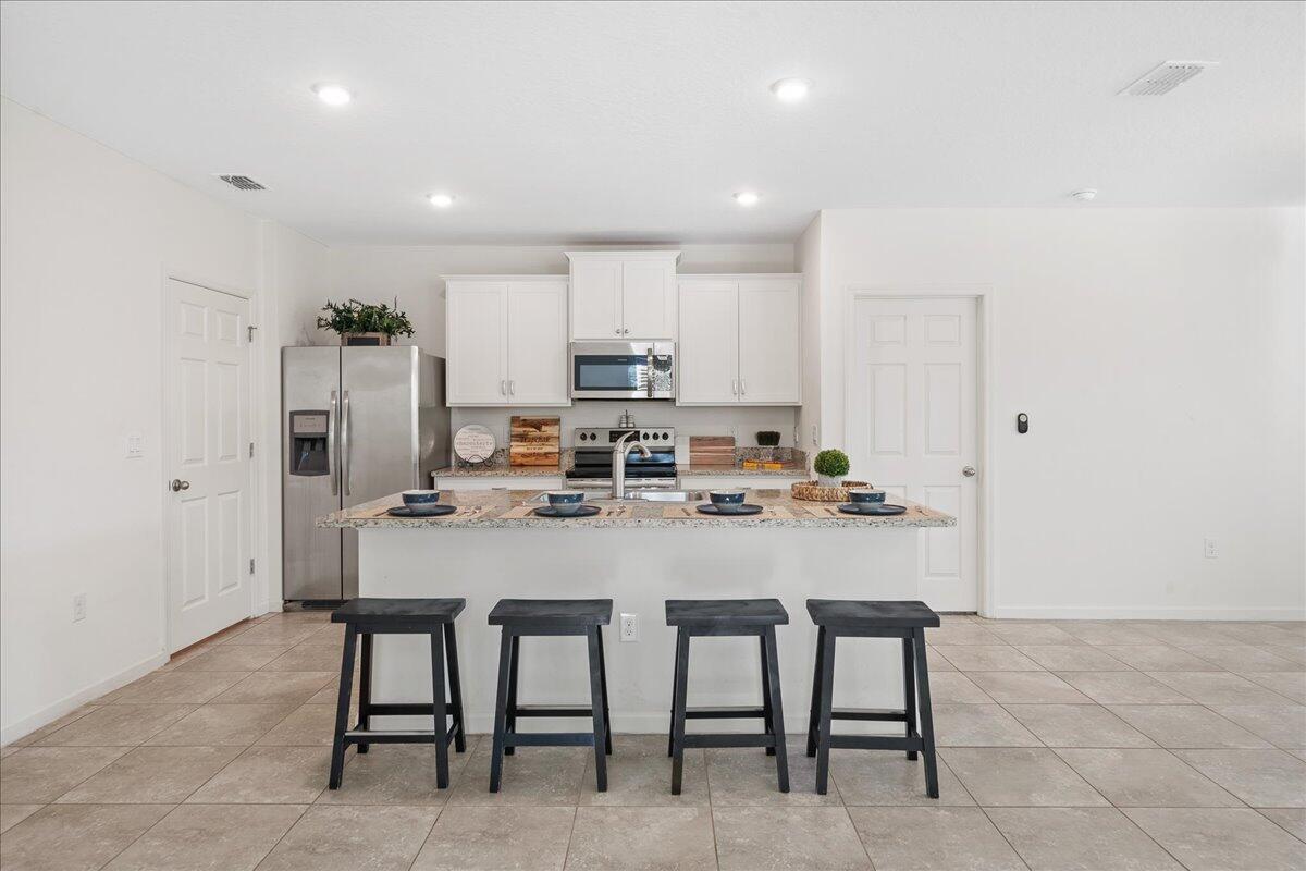 710 Old Country Rd S East Palm Bay, FL 32909 - Photo 5 of 27 a view of a dining room with furniture