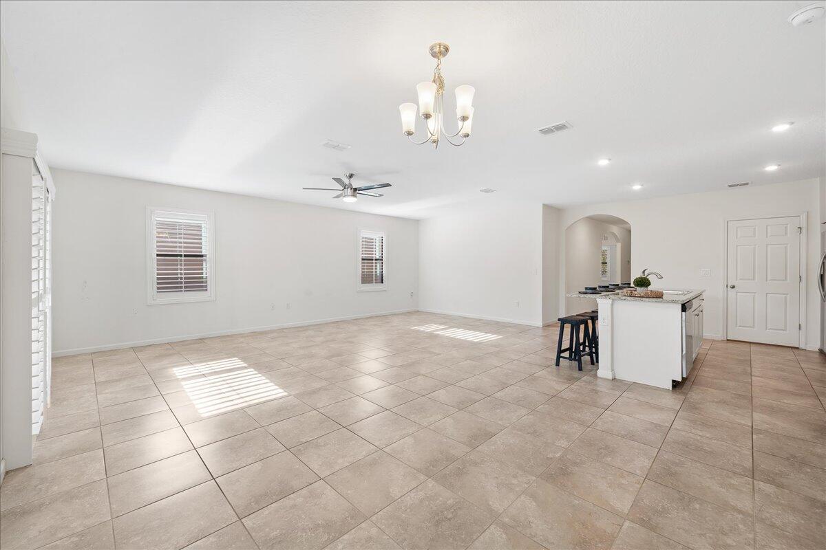 710 Old Country Rd S East Palm Bay, FL 32909 - Photo 8 of 27 a view of kitchen with furniture and refrigerator