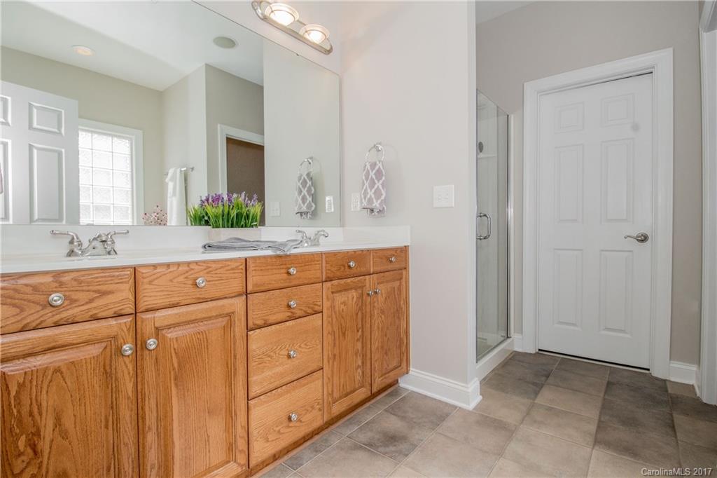 618 Lena Way Fort Mill, SC 29708 - Photo 17 of 24 a bathroom with a granite countertop sink and a mirror