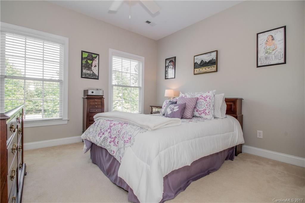 618 Lena Way Fort Mill, SC 29708 - Photo 21 of 24 a bedroom with a large bed and a large window
