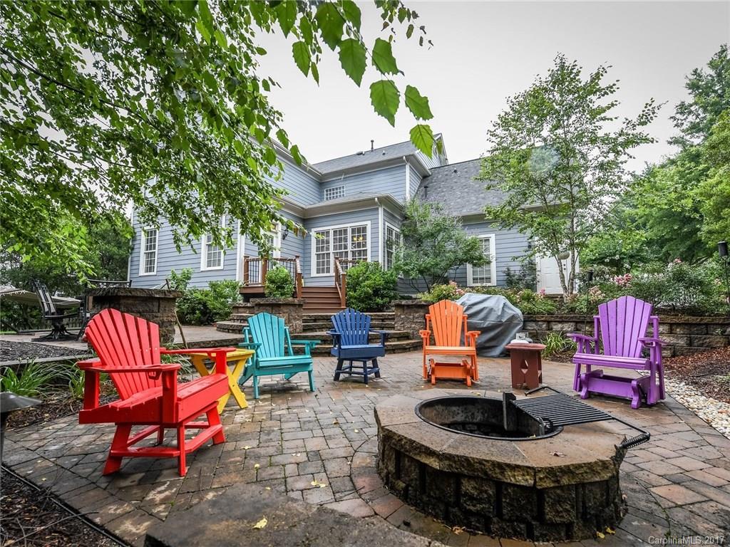 618 Lena Way Fort Mill, SC 29708 - Photo 24 of 24 a backyard of a house with fire pit and outdoor seating