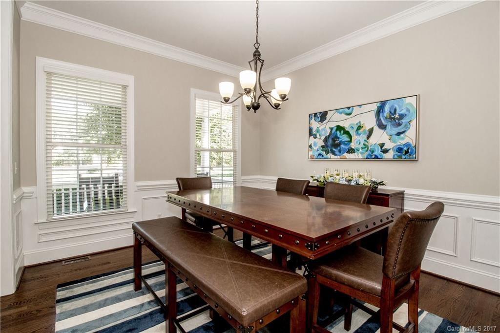 618 Lena Way Fort Mill, SC 29708 - Photo 6 of 24 a view of a dining room with furniture a chandelier and wooden floor