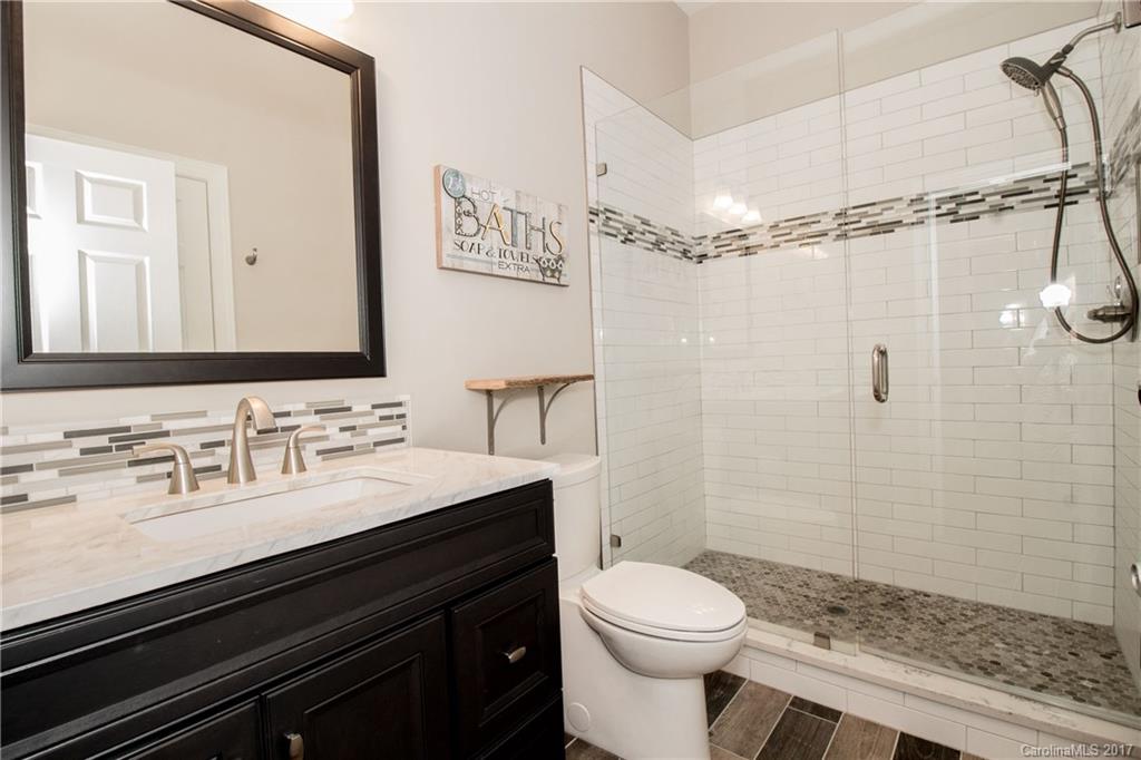 618 Lena Way Fort Mill, SC 29708 - Photo 8 of 24 a bathroom with a sink a toilet a mirror and shower