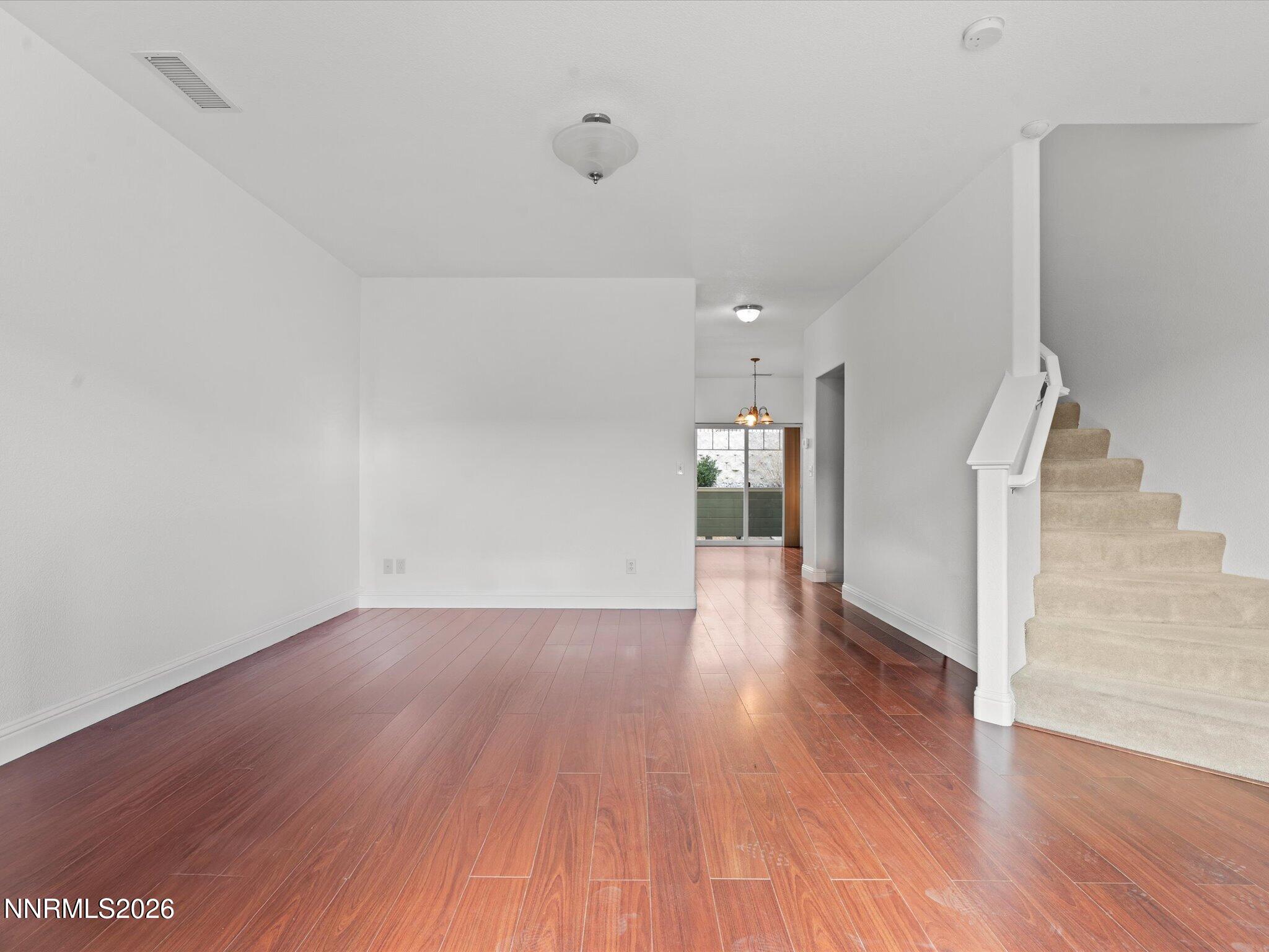 4795 Ciarra Kennedy Lane Reno, NV 89503 - Photo 12 of 37 a view of a hallway with wooden floor