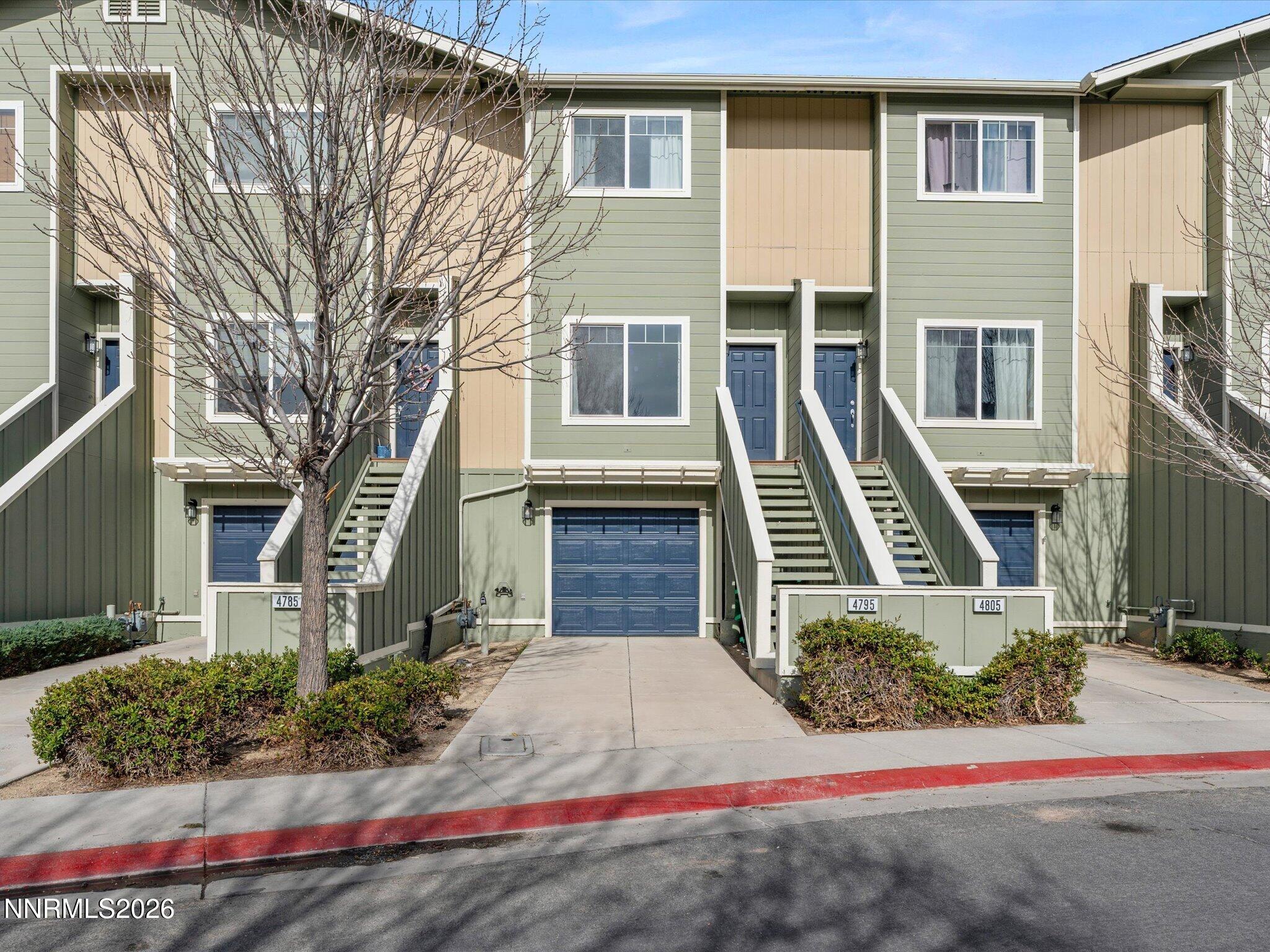 4795 Ciarra Kennedy Lane Reno, NV 89503 - Photo 2 of 37 a front view of a house with a yard