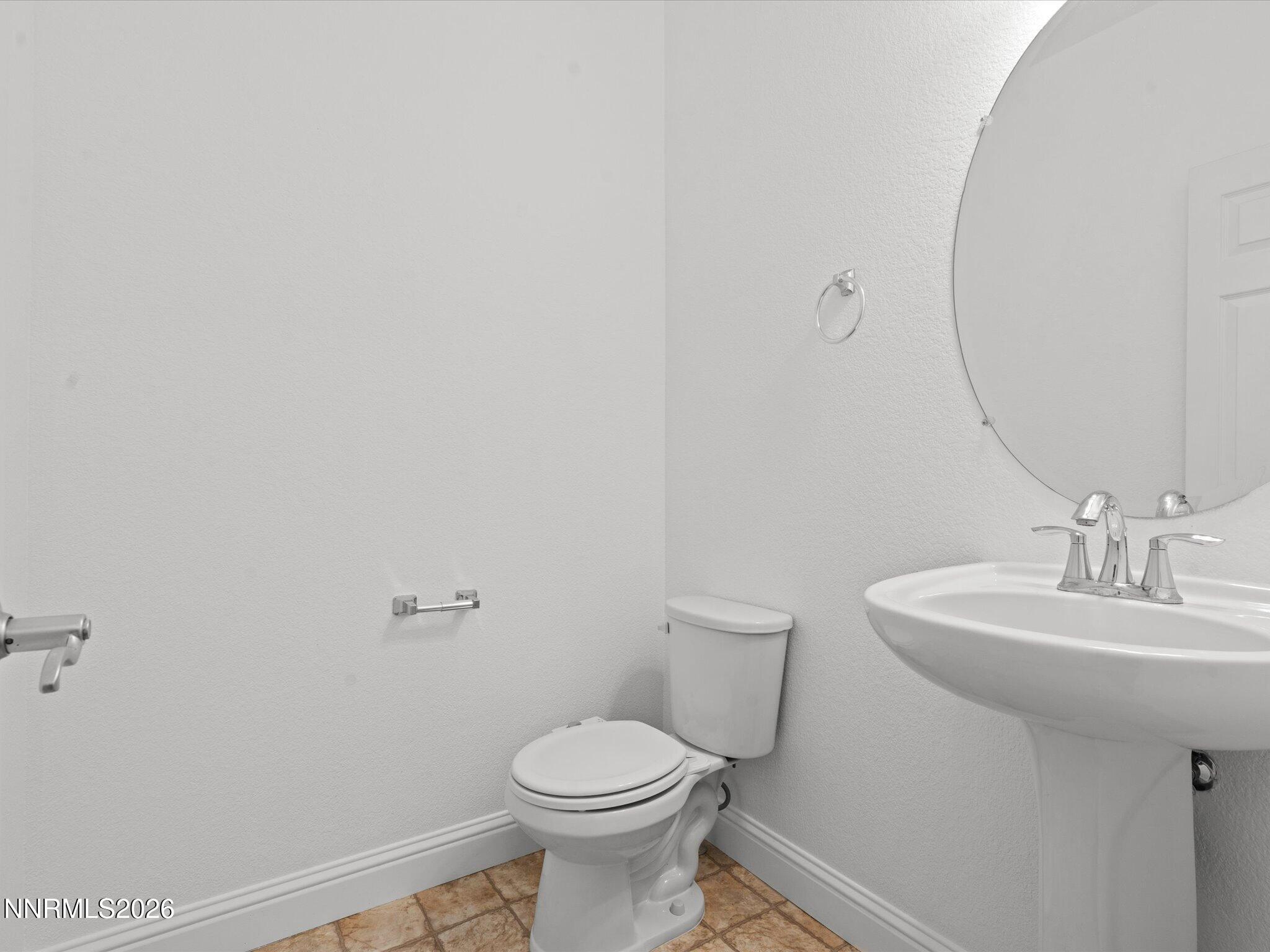 4795 Ciarra Kennedy Lane Reno, NV 89503 - Photo 26 of 37 a bathroom with a sink toilet and a mirror