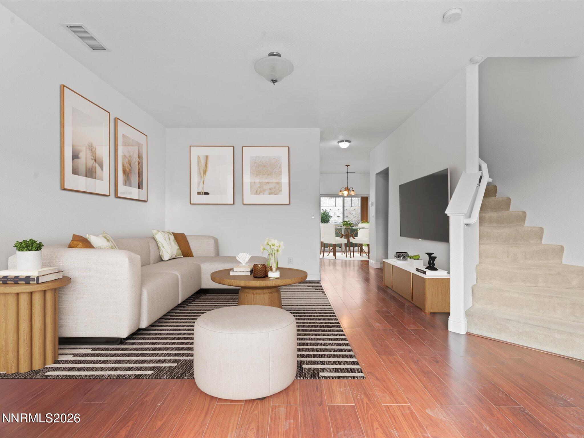 4795 Ciarra Kennedy Lane Reno, NV 89503 - Photo 7 of 37 a living room with furniture and a flat screen tv