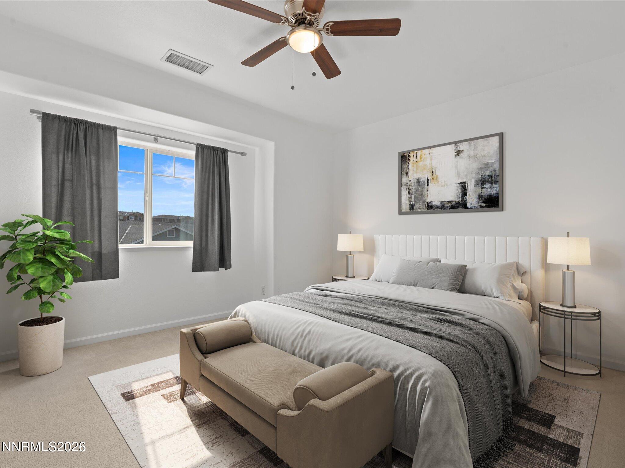 4795 Ciarra Kennedy Lane Reno, NV 89503 - Photo 10 of 37 a bedroom with a bed furniture and a potted plant