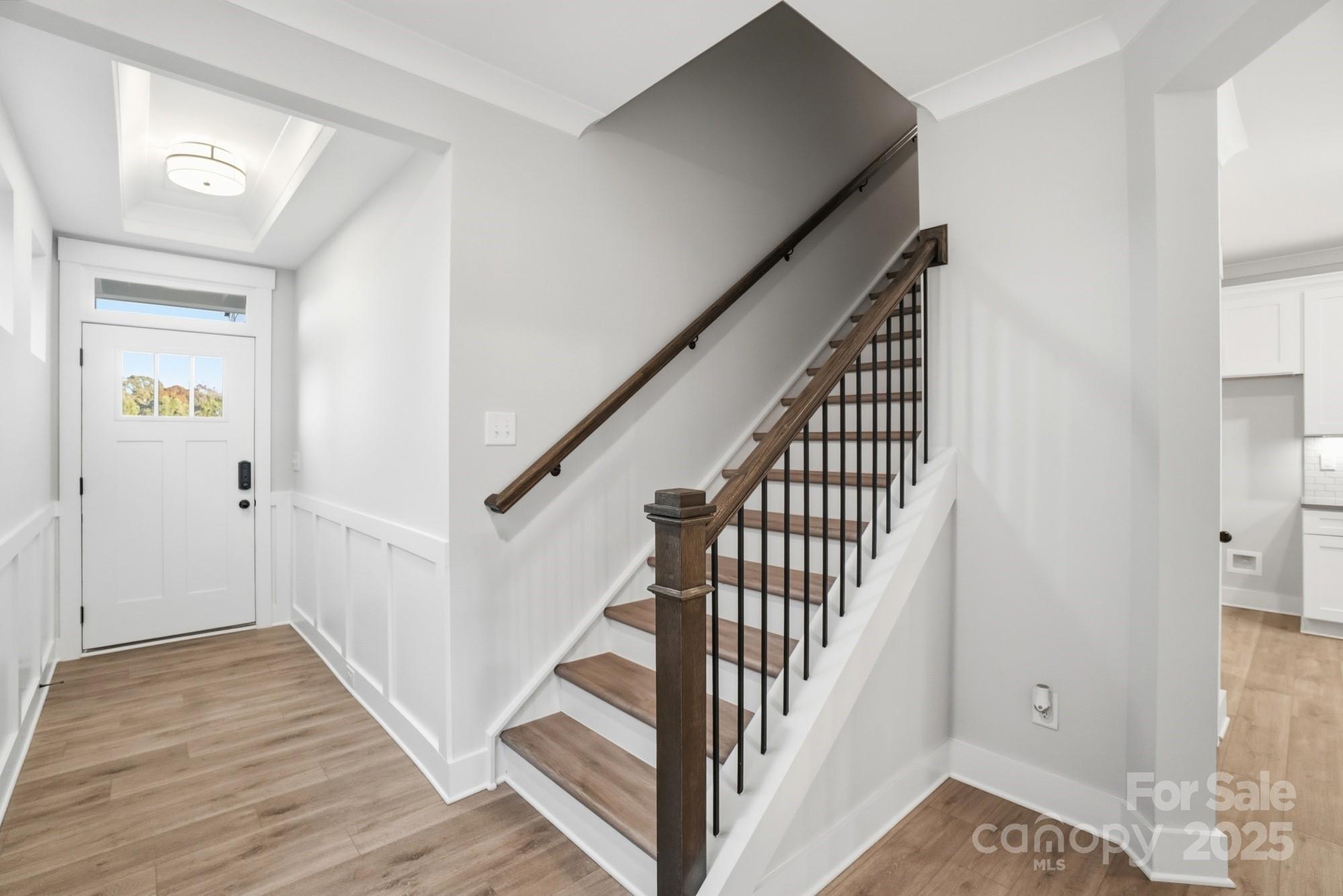 123 Viburnum Road Waxhaw, NC 28173 - Photo 12 of 28 a view of a hallway with wooden floor and entryway