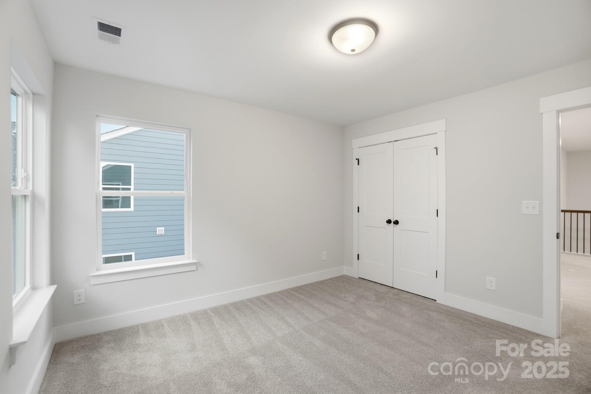 123 Viburnum Road Waxhaw, NC 28173 - Photo 24 of 28 an empty room with a window