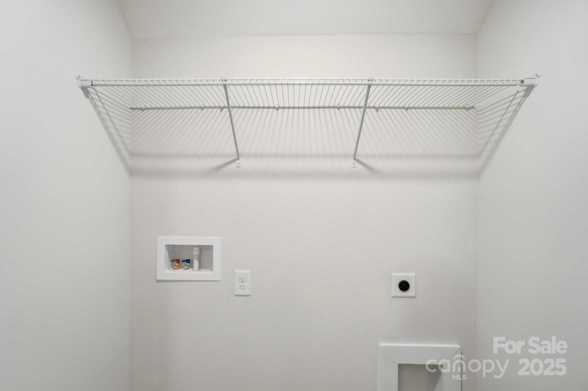 123 Viburnum Road Waxhaw, NC 28173 - Photo 25 of 28 a view of a room with racks on the wall