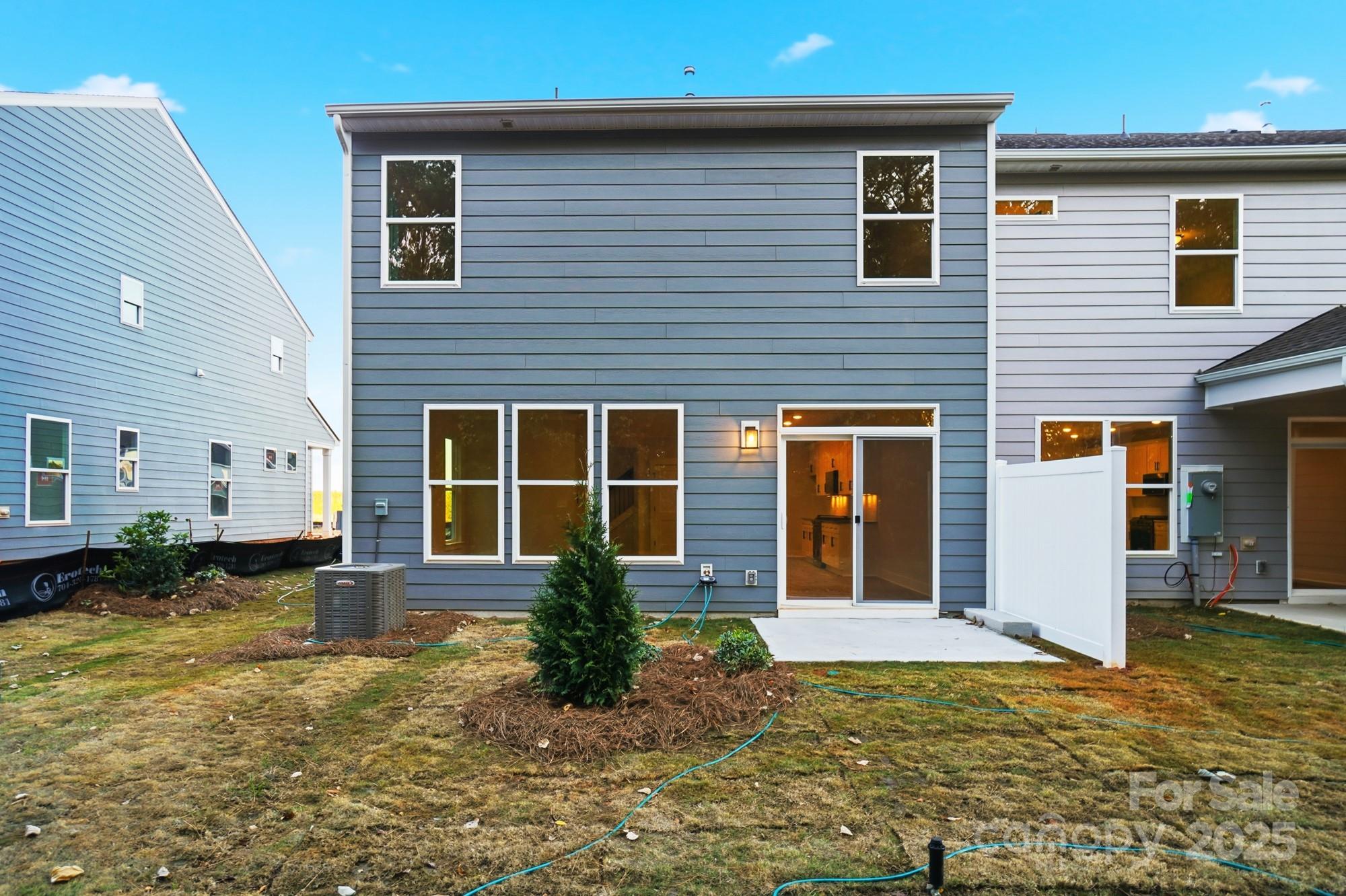 123 Viburnum Road Waxhaw, NC 28173 - Photo 28 of 28 a front view of a house with garden