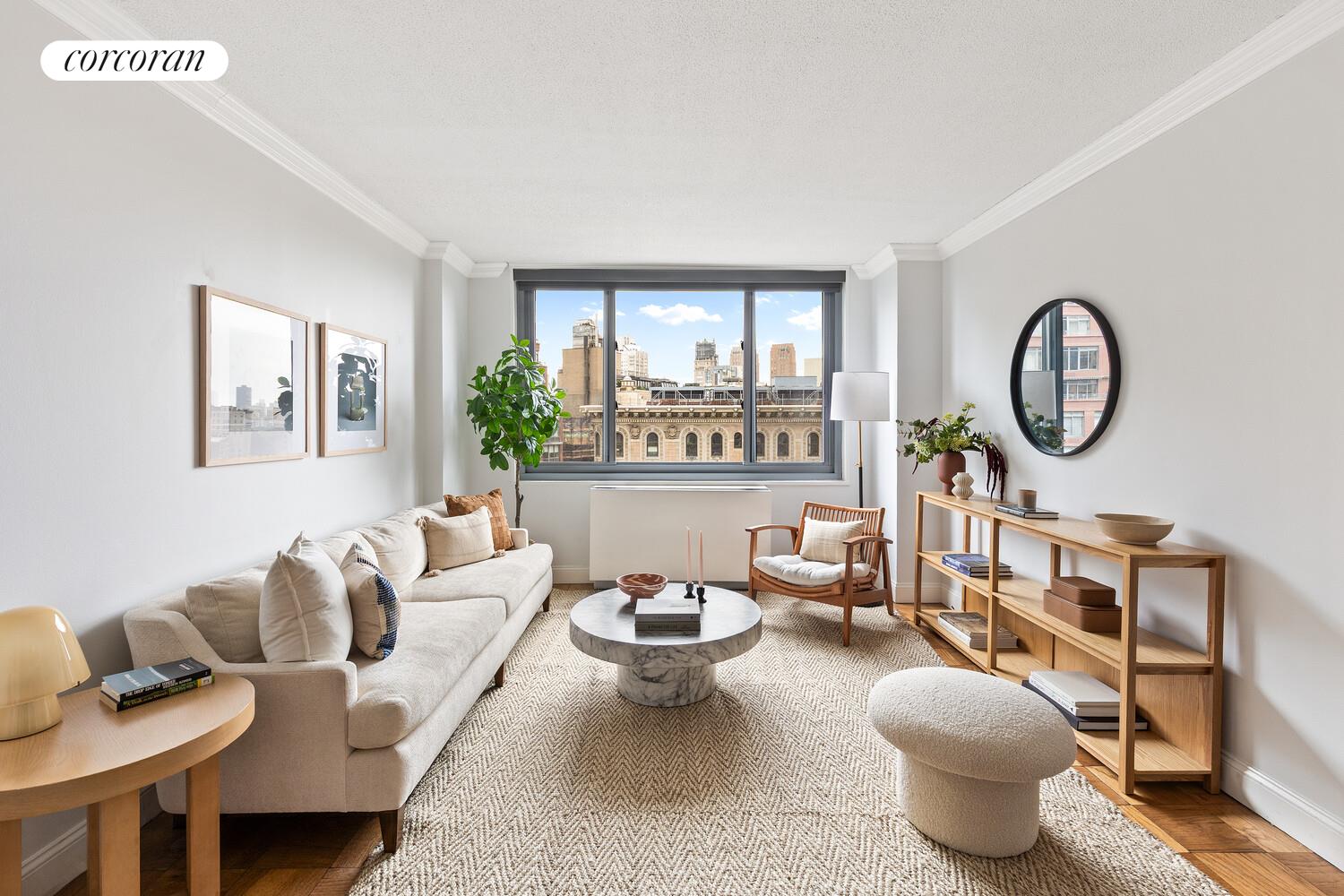 a living room with furniture a rug and a window