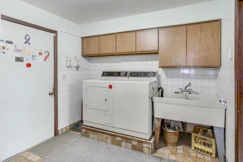 a kitchen with a sink a stove and a refrigerator
