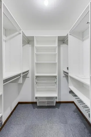 a view of an empty walk in closet