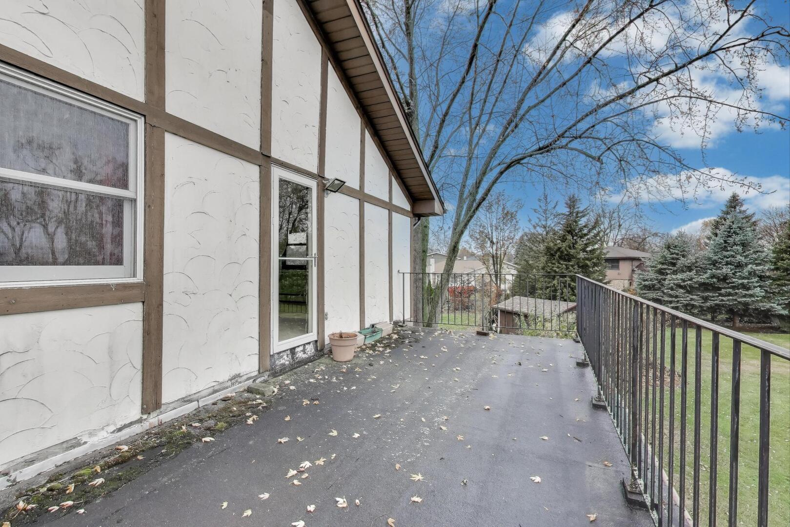 1040 South Linneman Road Mount Prospect, IL 60056 - Photo 21 of 39 a view of a house with a trees from a corridor