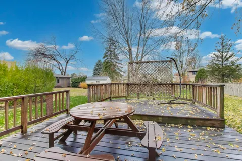 a view of a deck with furniture