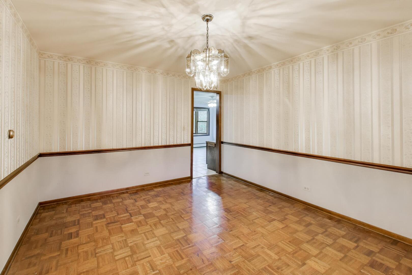 1040 South Linneman Road Mount Prospect, IL 60056 - Photo 5 of 39 a view of an empty room with a window