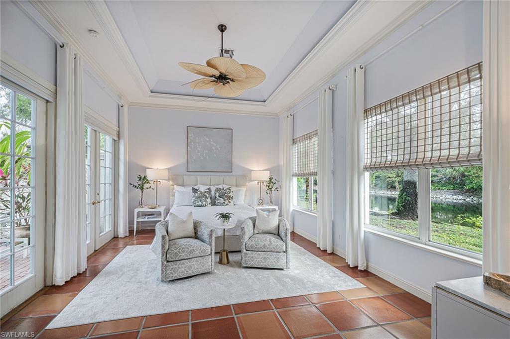 6648 Glen Arbor Way Naples, FL 34119 - Photo 23 of 47 a living room with furniture and a large window