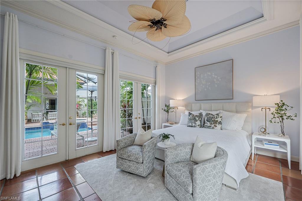 6648 Glen Arbor Way Naples, FL 34119 - Photo 24 of 47 a bedroom with furniture and a window