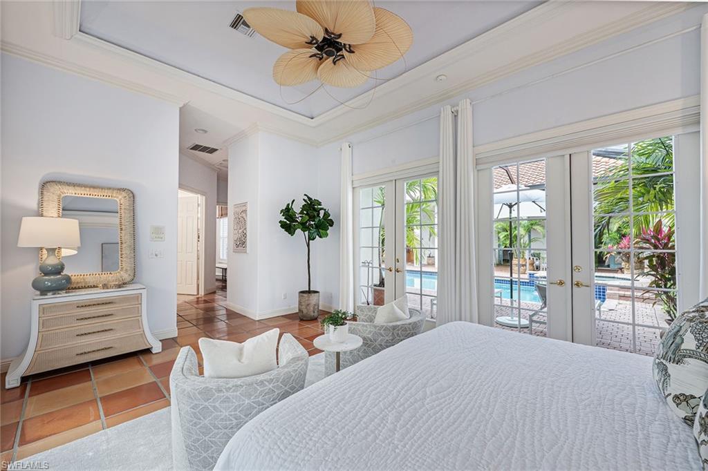 6648 Glen Arbor Way Naples, FL 34119 - Photo 25 of 47 a bedroom with two beds and large window