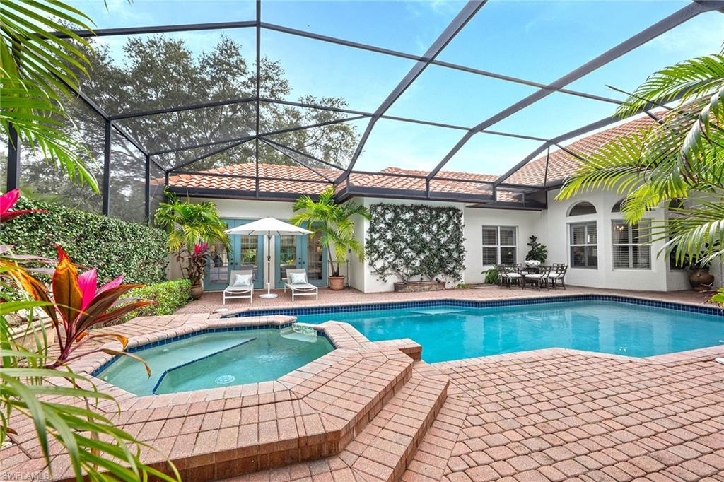 6648 Glen Arbor Way Naples, FL 34119 - Photo 33 of 47 a view of swimming pool with a patio