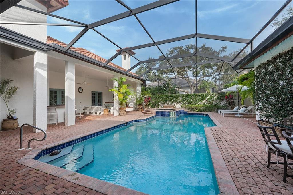 6648 Glen Arbor Way Naples, FL 34119 - Photo 37 of 47 a view of a swimming pool with a patio