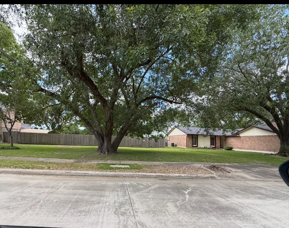 4908 Ripple Creek Drive Baytown, TX 77521 - Photo 3 of 5 a view of a yard in front of a house