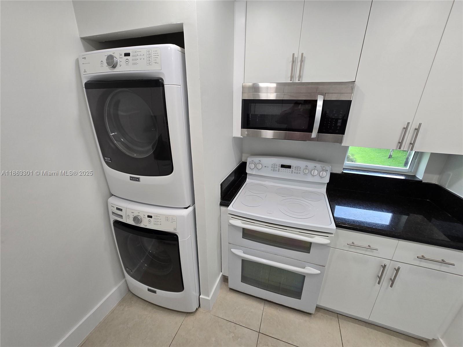 8886 Southwest 3rd Street, Unit 202 Pembroke Pines, FL 33025 - Photo 1 of 36 a utility room with dryer and washer