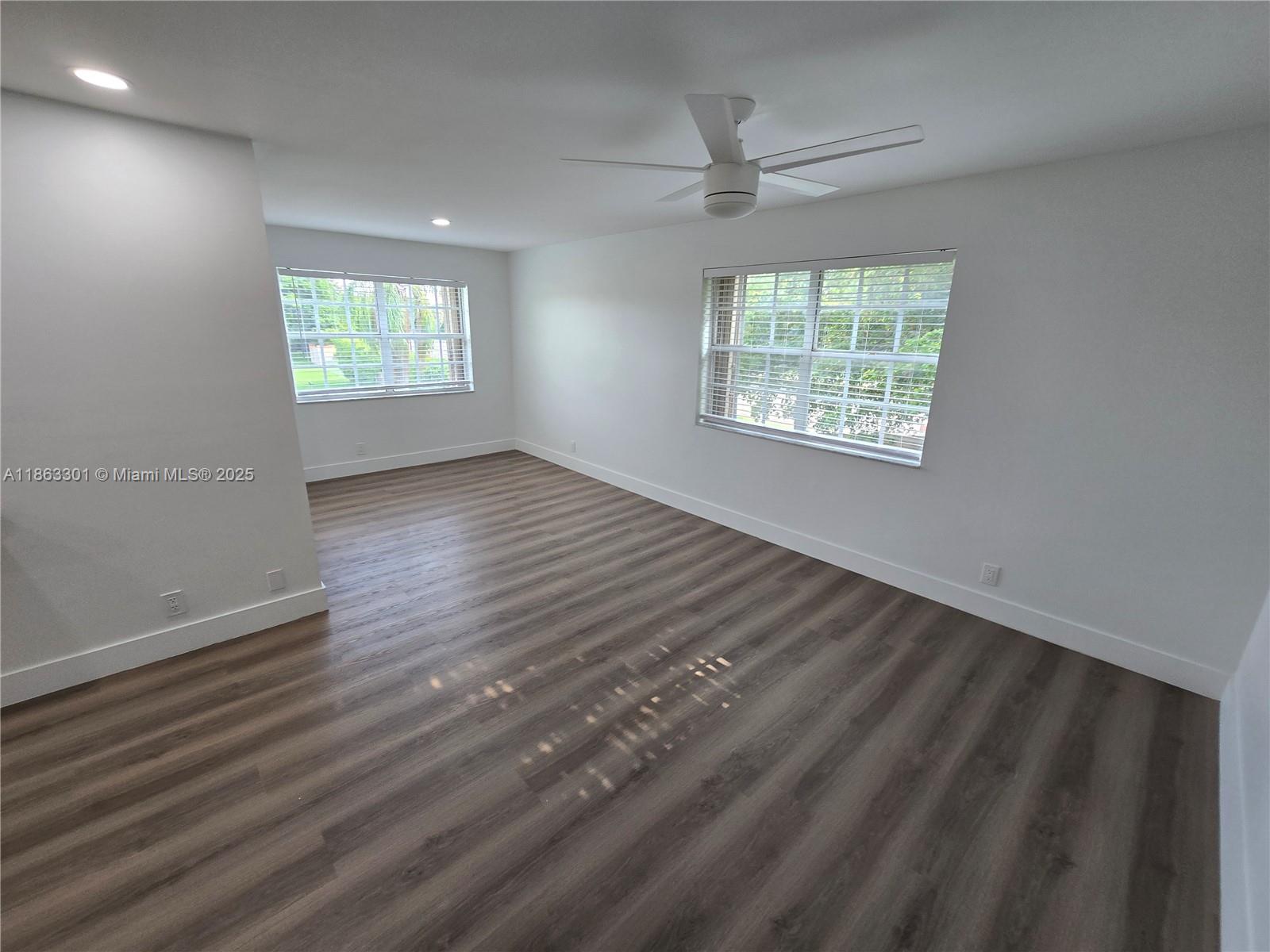 8886 Southwest 3rd Street, Unit 202 Pembroke Pines, FL 33025 - Photo 13 of 36 wooden floor in an empty room with a window
