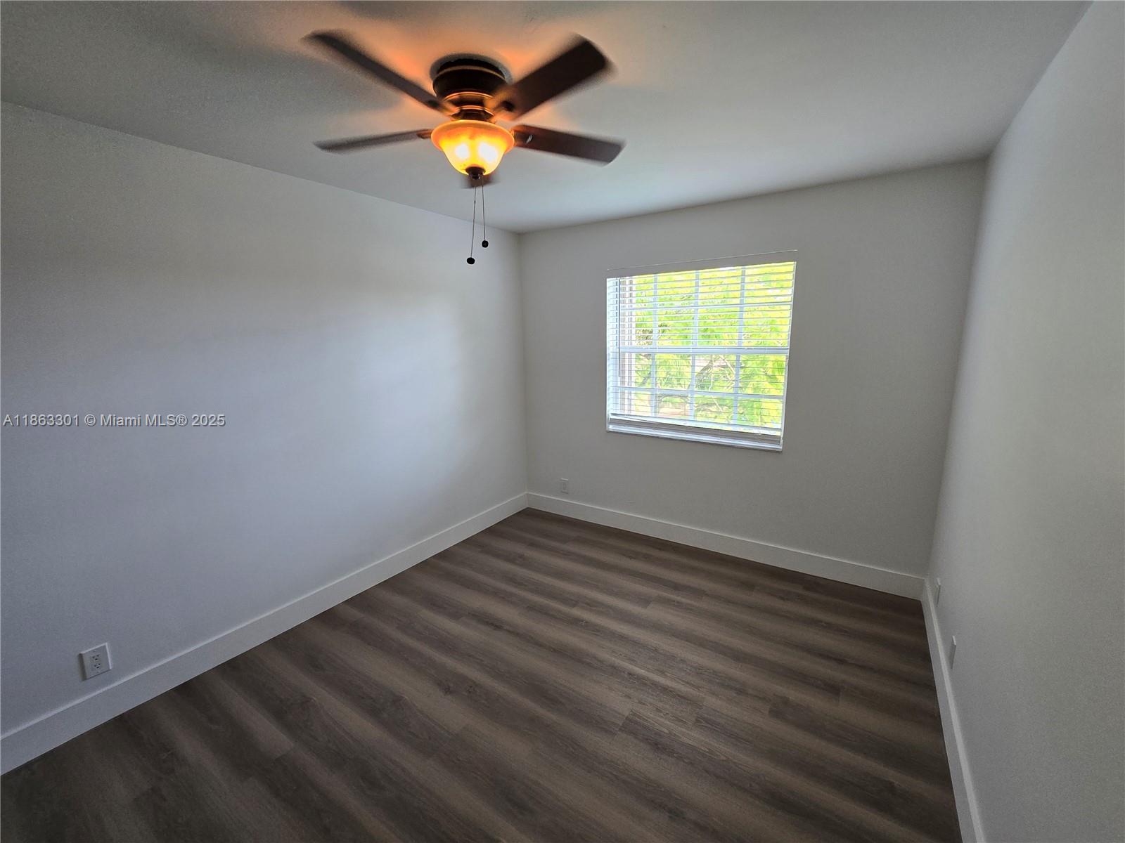 8886 Southwest 3rd Street, Unit 202 Pembroke Pines, FL 33025 - Photo 15 of 36 an empty room with a window and a fan