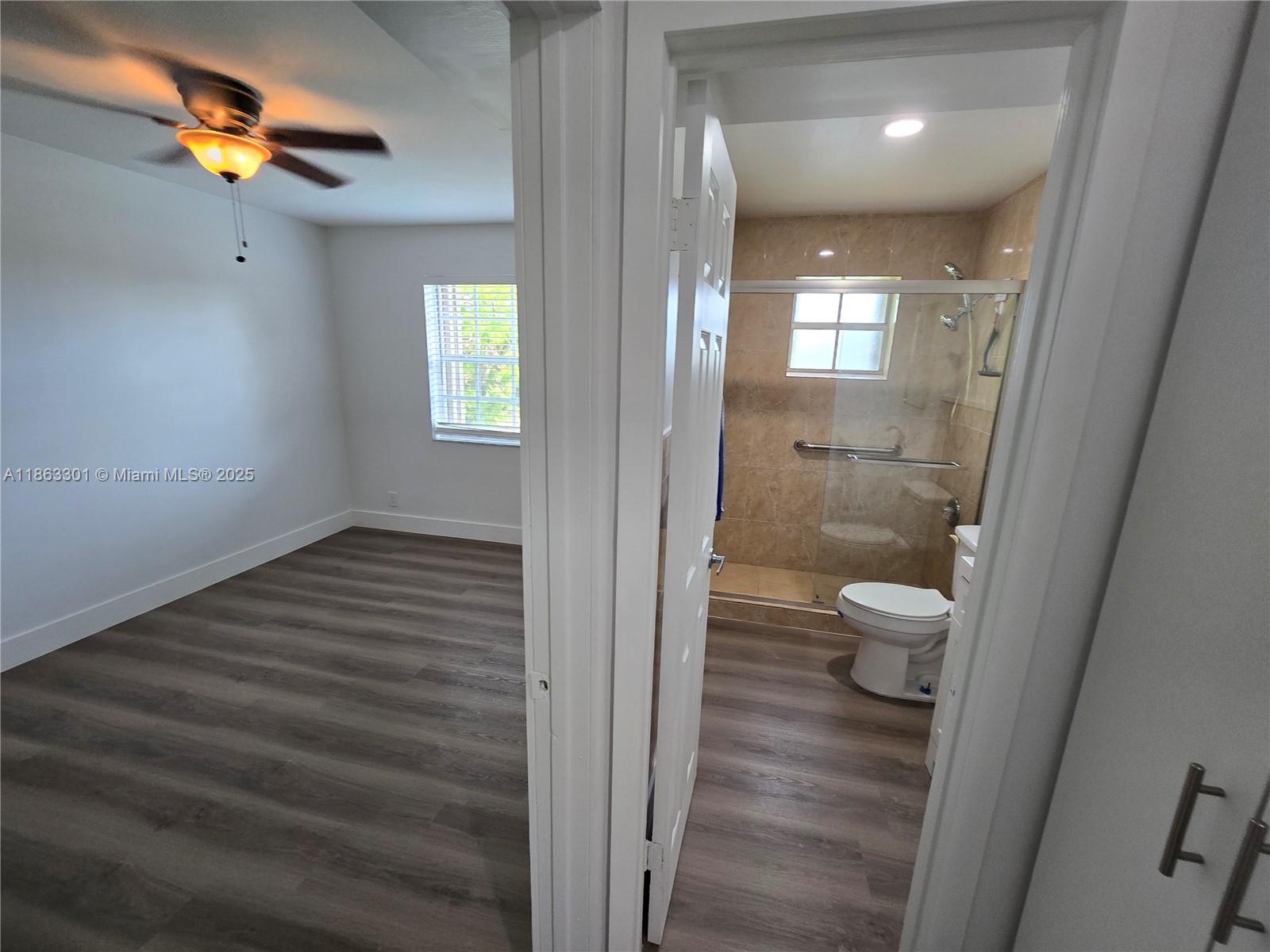 8886 Southwest 3rd Street, Unit 202 Pembroke Pines, FL 33025 - Photo 19 of 36 a bathroom with a toilet and a shower
