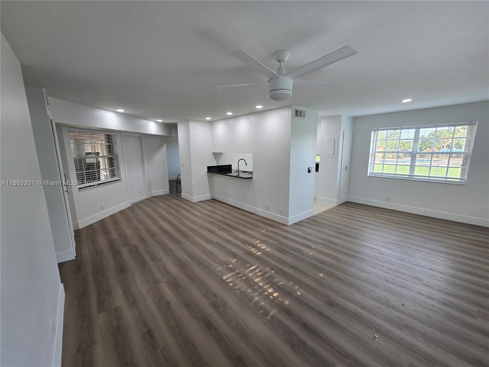 8886 Southwest 3rd Street, Unit 202 Pembroke Pines, FL 33025 - Photo 22 of 36 a view of a room with window and wooden floor