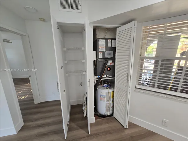 a bathroom with a sink a toilet a mirror and vanity