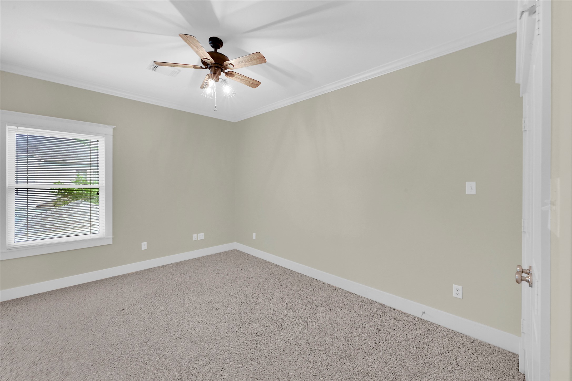 4418 Edsee Street Houston, TX 77009 - Photo 22 of 28 One of two secondary bedrooms, carrying on the home's theme of natural light and a neutral color palate.