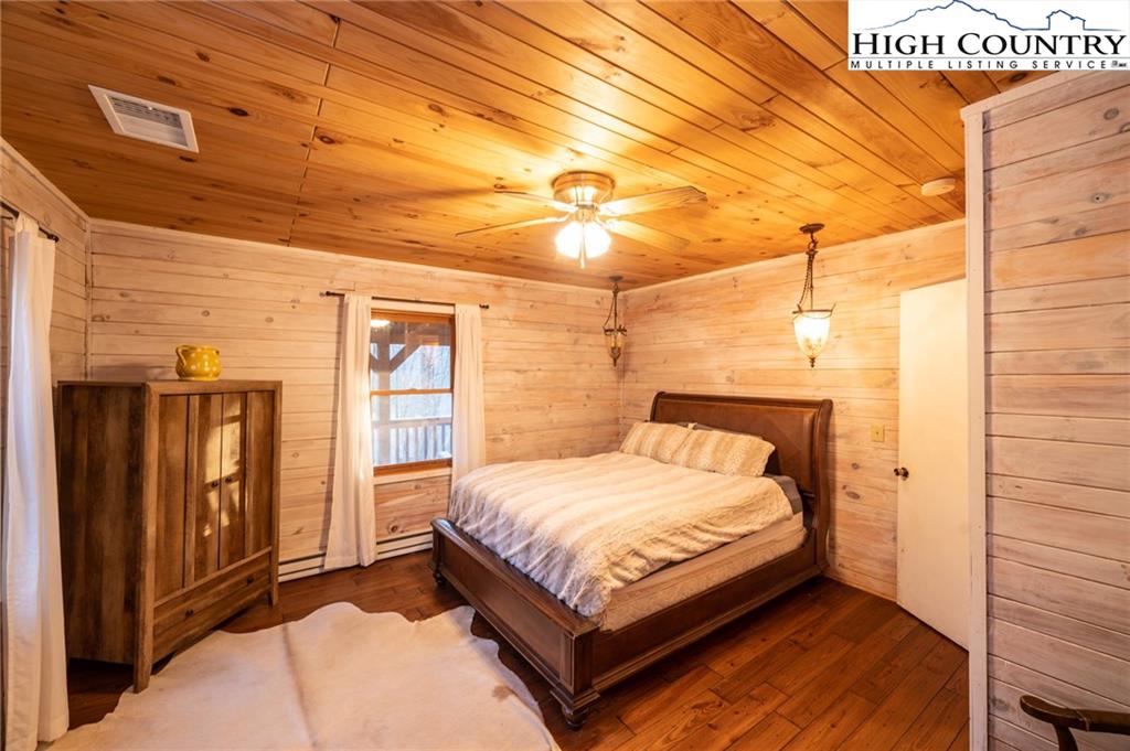 6218 Junaluska Road Boone, NC 28607 - Photo 17 of 33 a bedroom with a bed and window