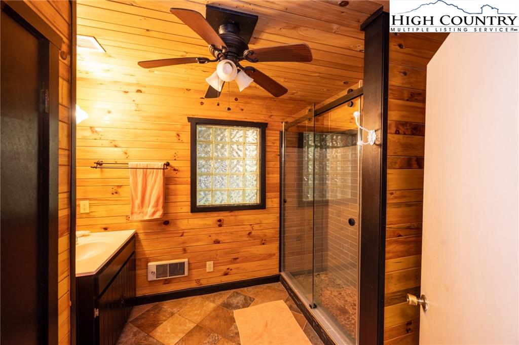 6218 Junaluska Road Boone, NC 28607 - Photo 19 of 33 a bathroom with a tub and shower