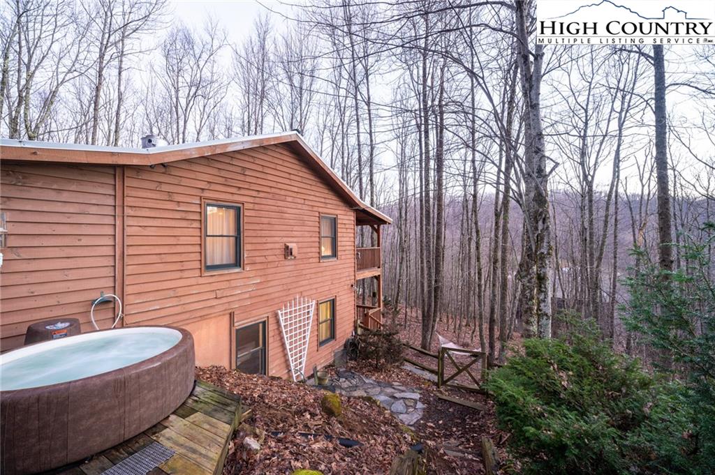 6218 Junaluska Road Boone, NC 28607 - Photo 31 of 33 a backyard of house with outdoor seating