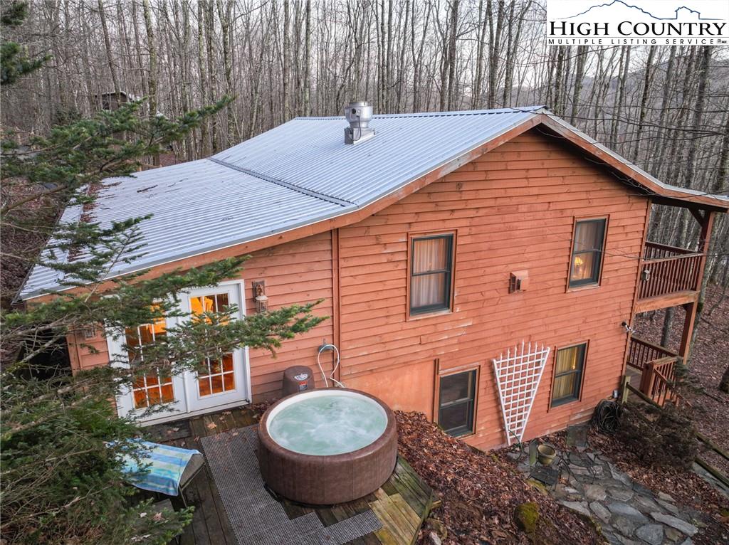 6218 Junaluska Road Boone, NC 28607 - Photo 4 of 33 a backyard of a house with table and chairs
