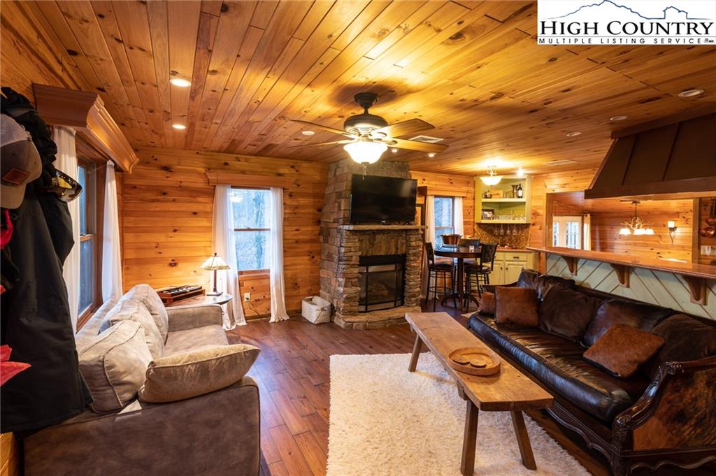 6218 Junaluska Road Boone, NC 28607 - Photo 7 of 33 a outdoor living space with patio furniture and a flat screen tv