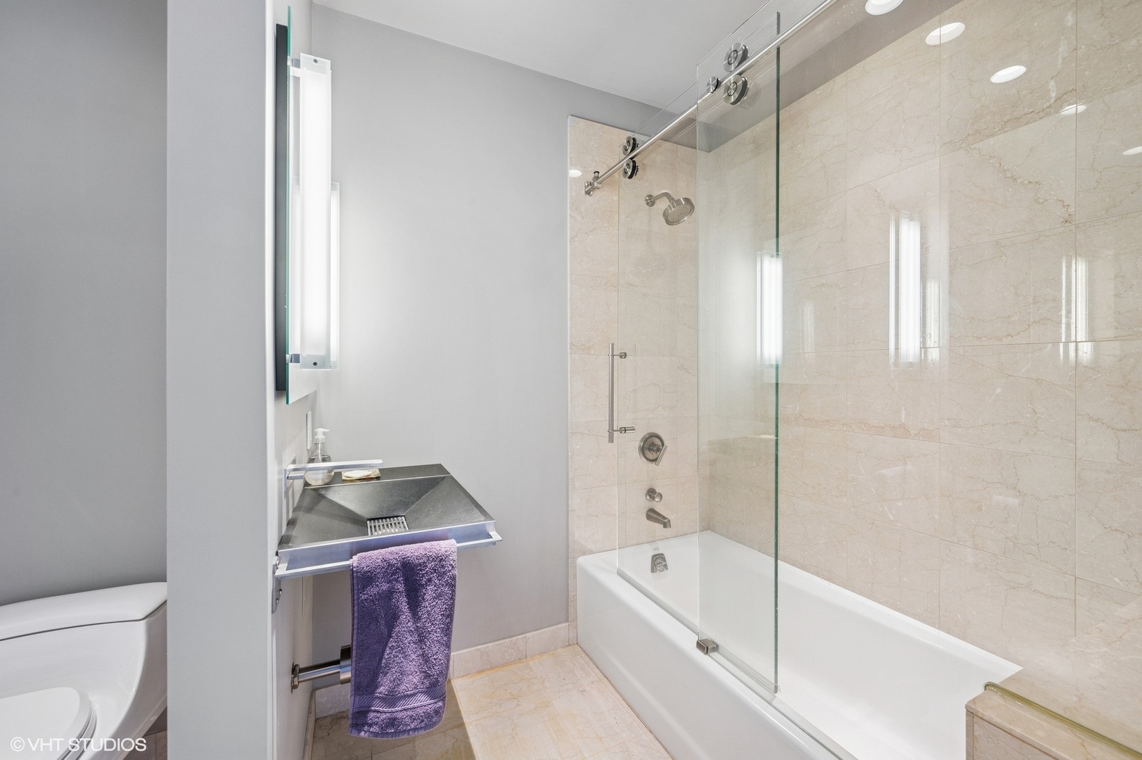 401 North Wabash Avenue, Unit 33K Chicago, IL 60611 - Photo 14 of 45 a bathroom with a bathtub toilet and sink